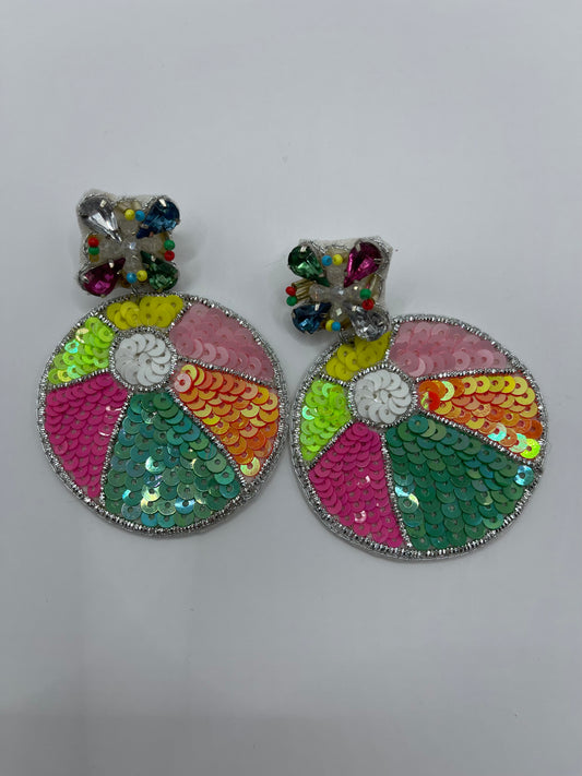 A pair of colorful, round earrings designed to resemble beach balls with sequins and beads.