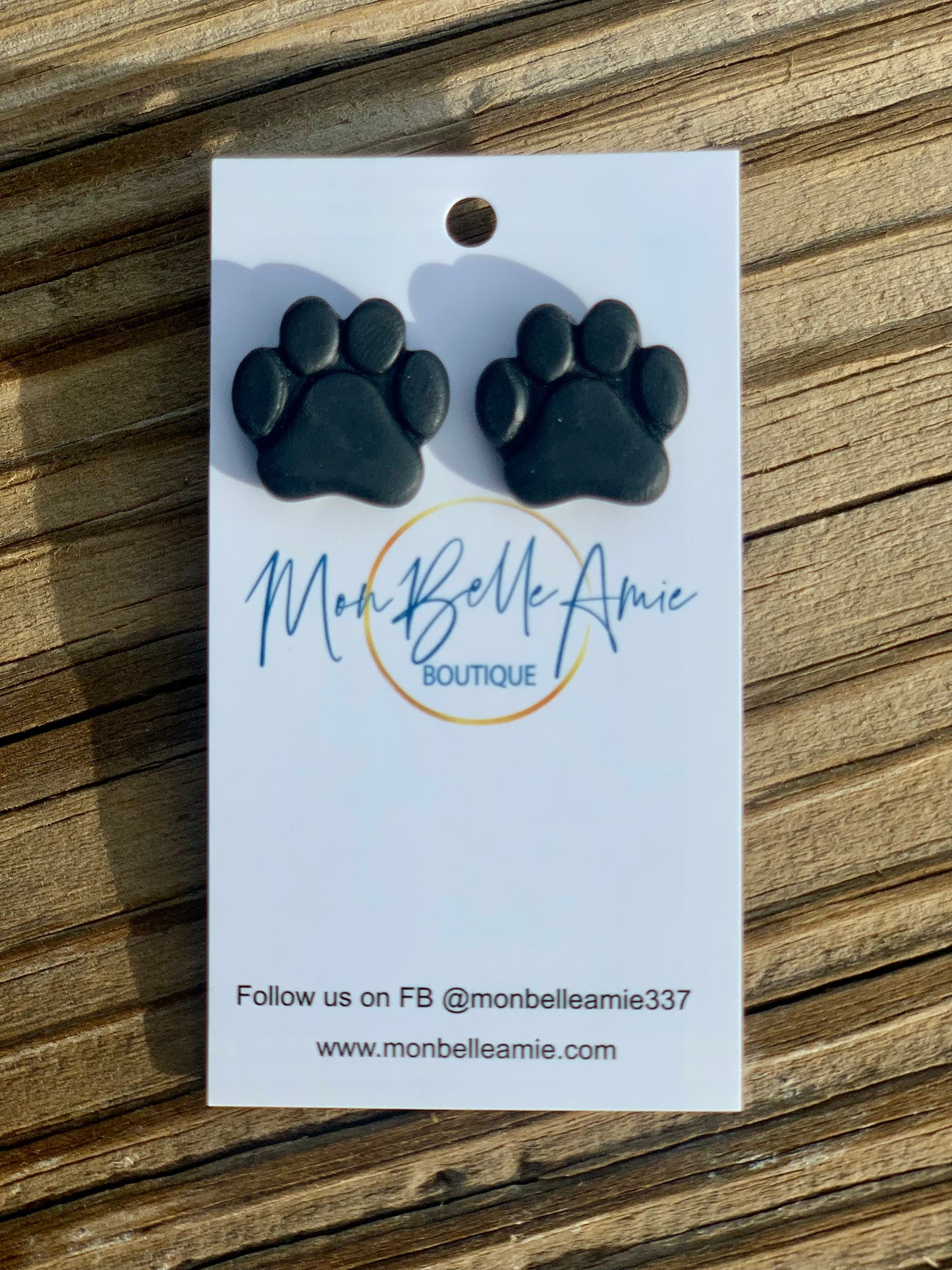 Black paw print studs